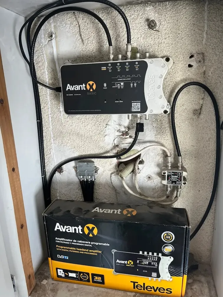 TV aerial amplifier installed in a junction box