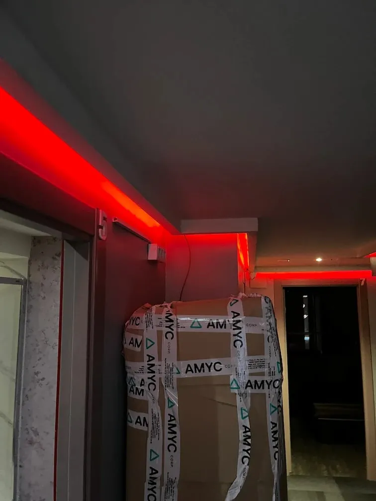 Corridor with a red LED strip running along the ceiling