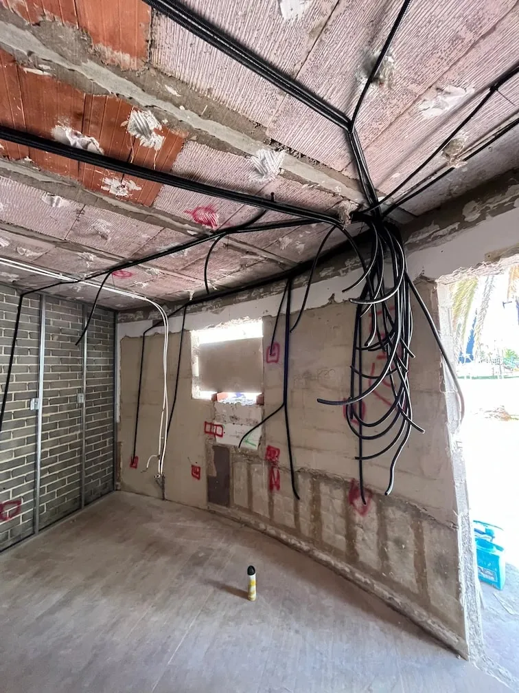 Premises under construction with the new wiring running across the ceiling